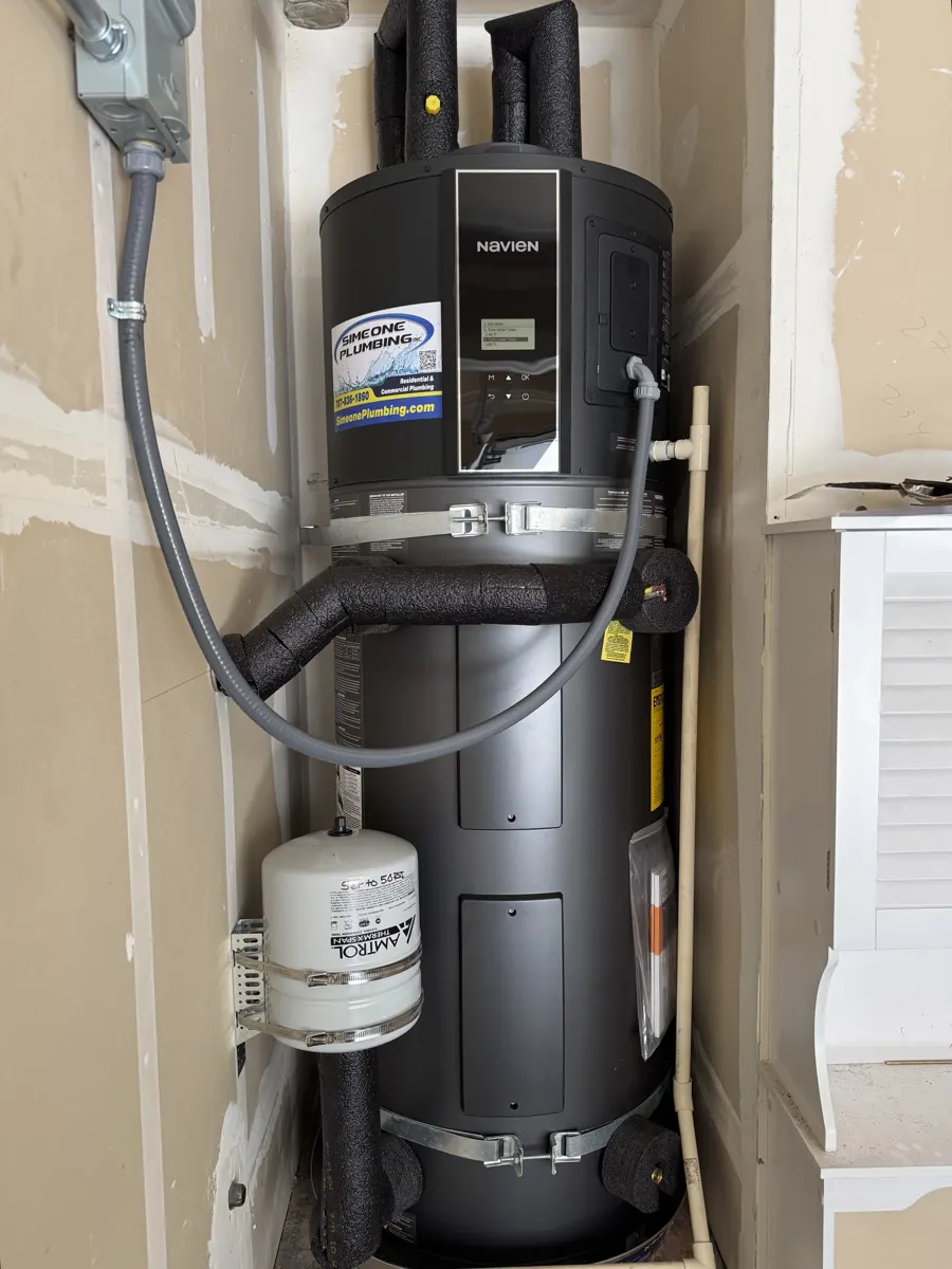 Navien heat pump water heater installed by Simeone Plumbing in a closet