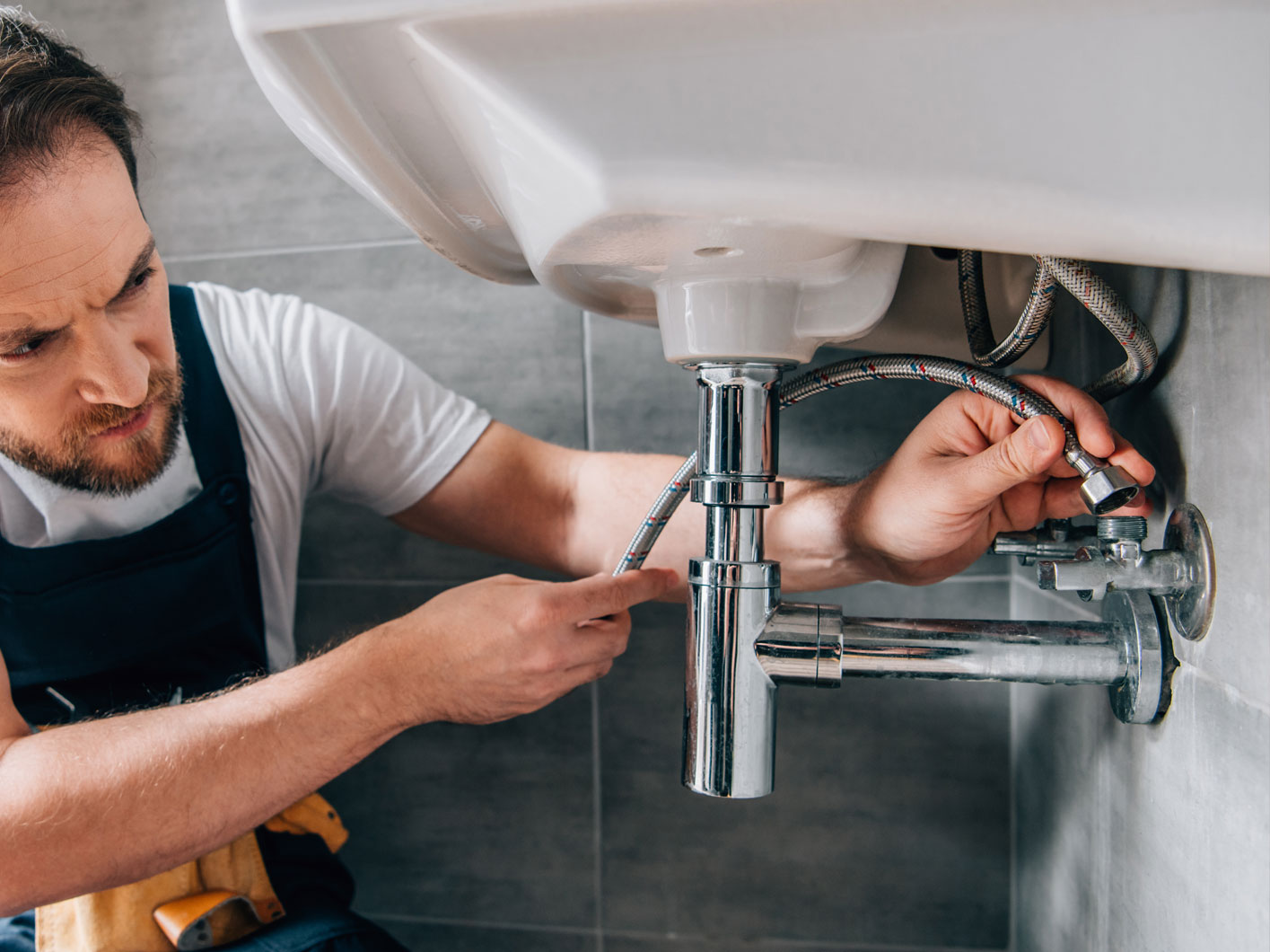 Simeone Plumbing technician working in a Sonoma County home